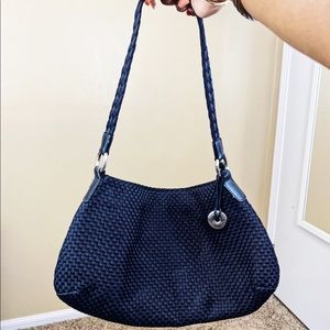 Black woven satchel bag by The Sak